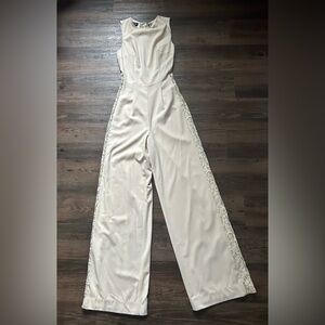 Bebe Cream Jumpsuit with Lace Side Panels